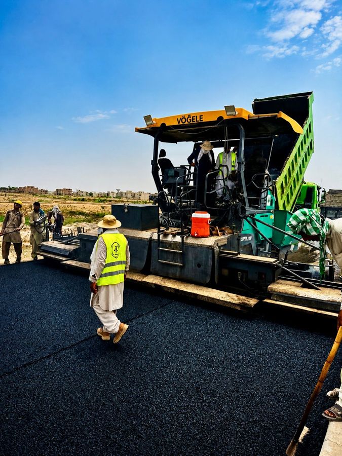 Asphalt paver machine on site